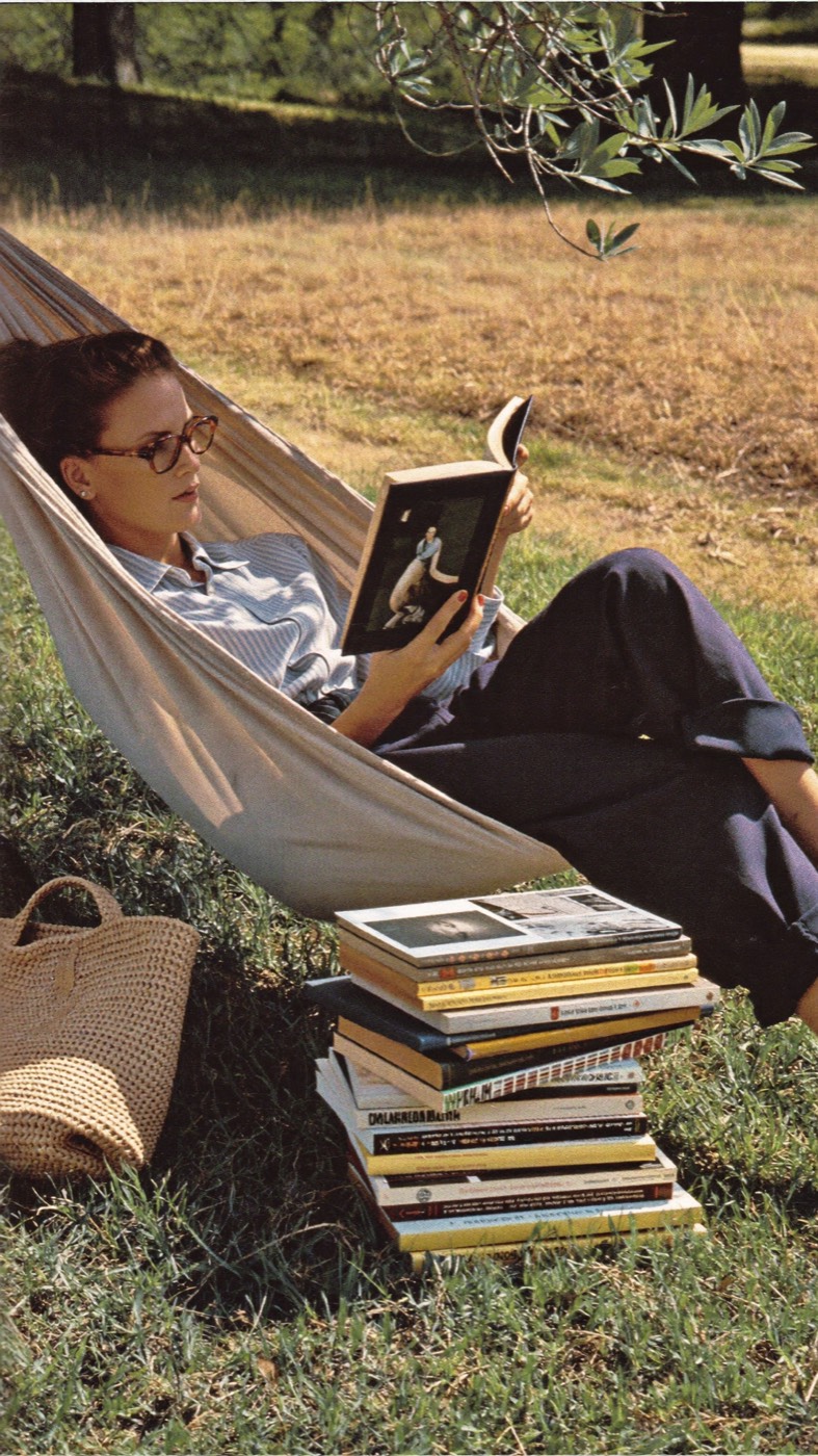 Reading in a hammock with art books
